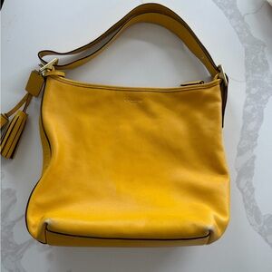 Coach duffle bag is identified as the Legacy